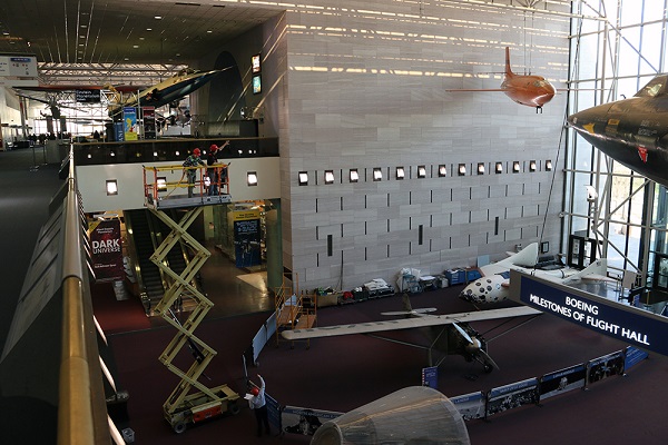 Museum staff hang the invisible plane and transform it into its jet formation.  (Photo courtesy: Marty Kelsey)