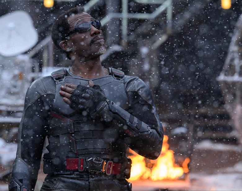 Wesley Snipes dressed as Blade, wearing his iconic black leather outfit and sunglasses